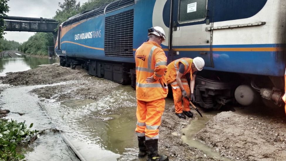 Workmen at site of stranded train