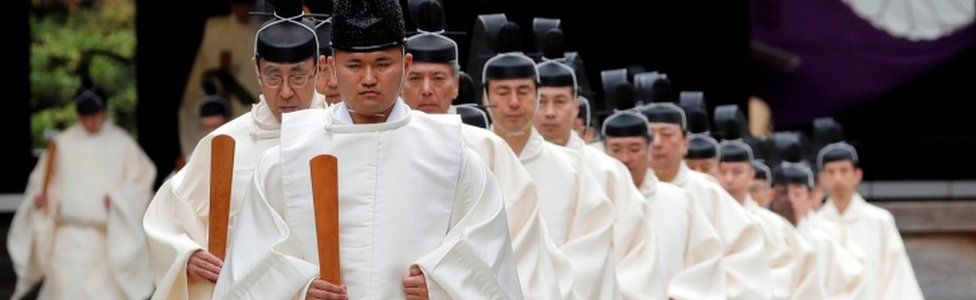 Shinto priests attend a ritual during an autumn festival at the Yasukuni Shrine in Tokyo