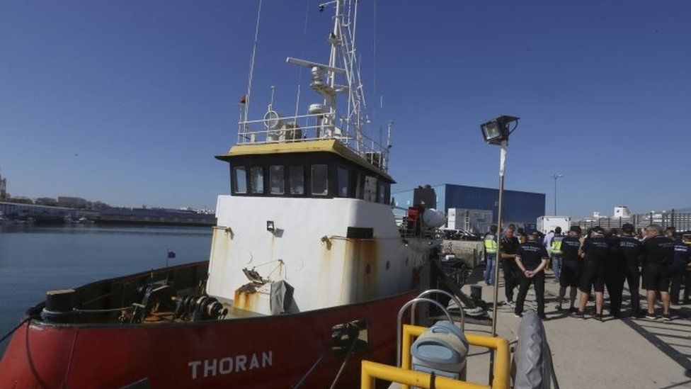 Spanish police gather next to the tug boat that was allegedly carrying a 3.8 tonnes of cocaine (07 October 2017)