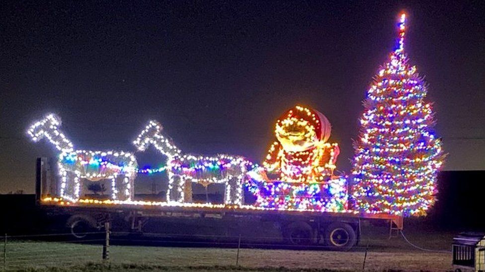 Christmas bale sculpture in 2021 at White Stacks Farm, in Kibworth, Leicestershire