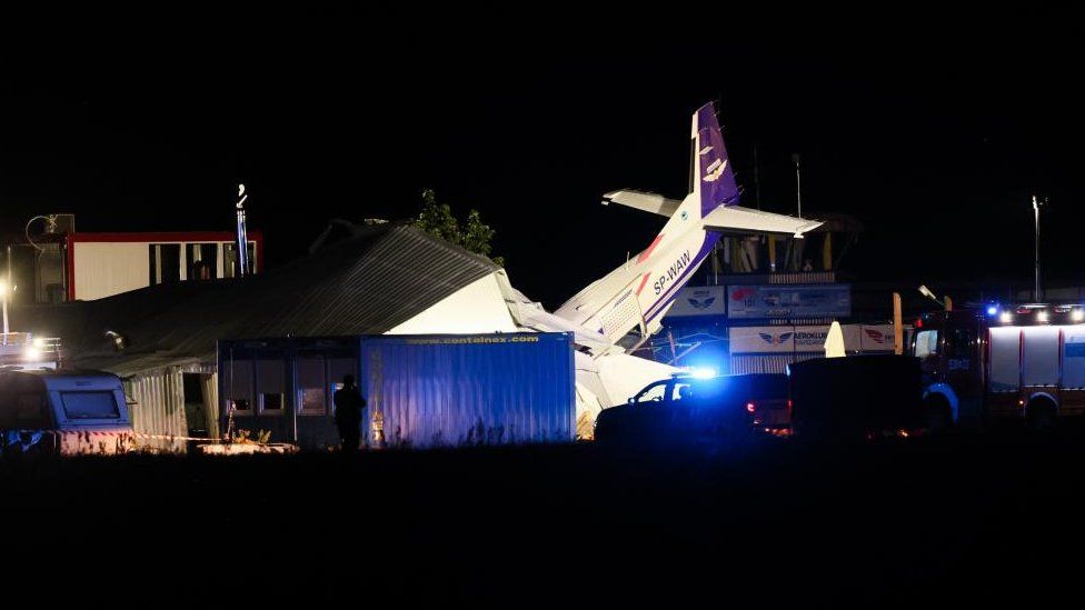 A general night view showing the site of a plane crash in Chrcynno north of Warsaw, Poland, 17 July 2023.