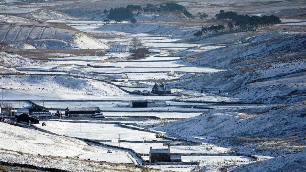 Farmhouses in Teesdale in County Durham after a band of wintry weather brought hill snow