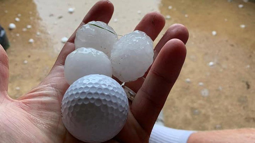 Golf ball next to hail