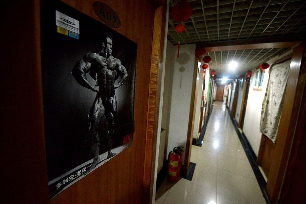 This picture taken on 14 January 2014 shows a poster on the door of a room at the entrance to a basement in Beijing