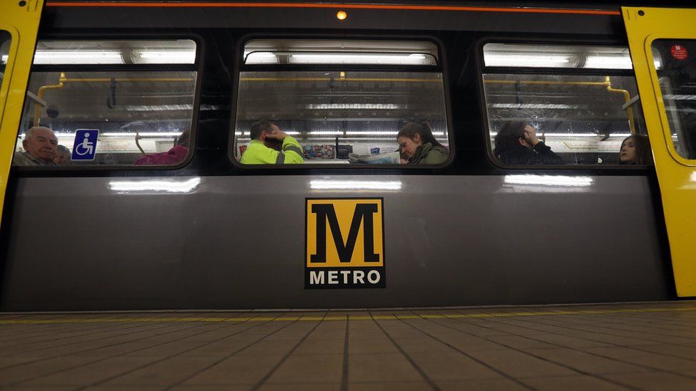 Passengers on a Metro carriage