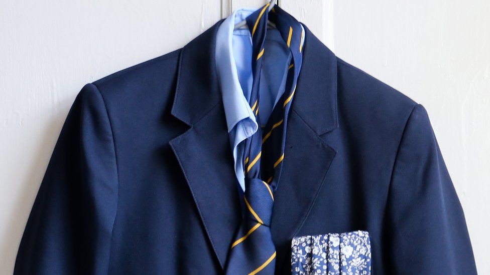 School uniform on clothes hanger
