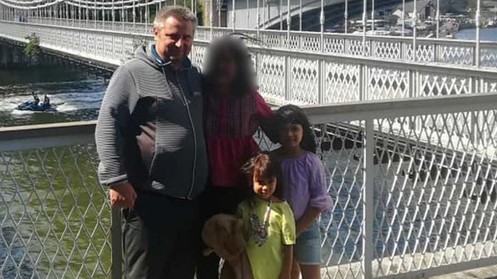 Bartlomiej Kuczynski, 45, a woman, 12-year-old-Jasmin Kuczynska, and Natasha Kuczynska, aged nine, near a river bridge