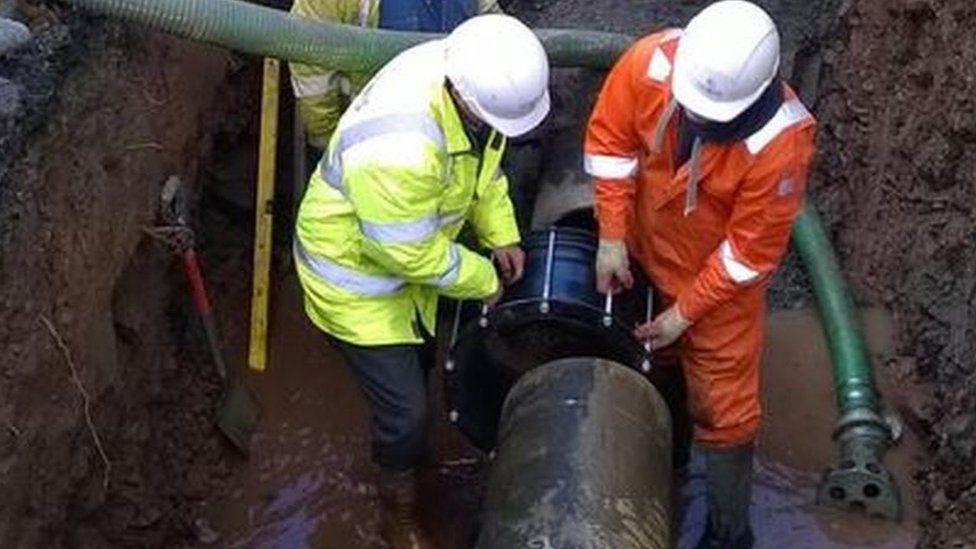 Welsh Water engineers fixing the burst mains