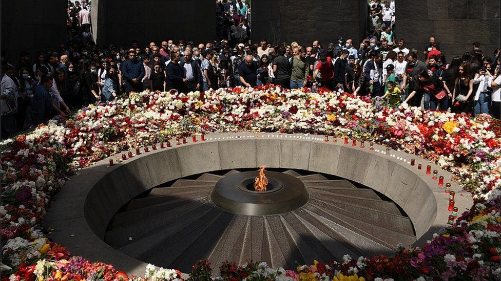 People take part in a commemorative ceremony for 1.5 million Armenians killed in the Ottoman-era slaughter at the Tsitsernakaberd Armenian Genocide Memorial complex in Yerevan, Armenia, 24 April 2021