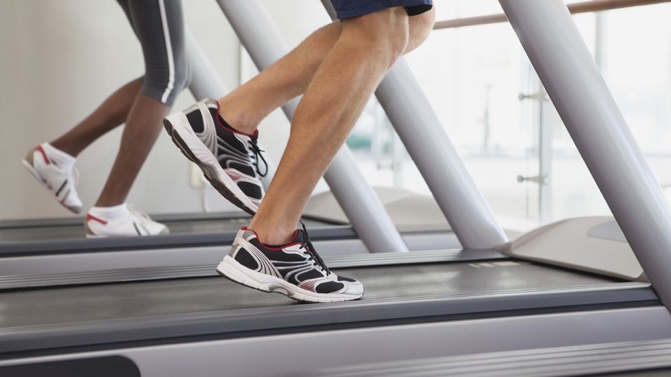 Close-up of running legs on a treadmill