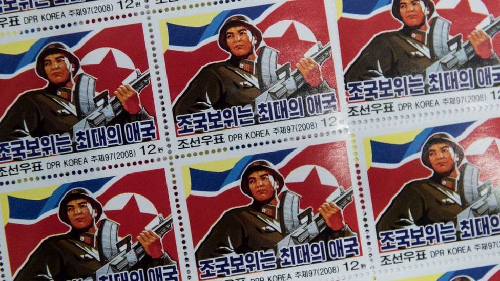 Military-themed stamps displayed at a shop in central Pyongyang. North Korea. November 2017