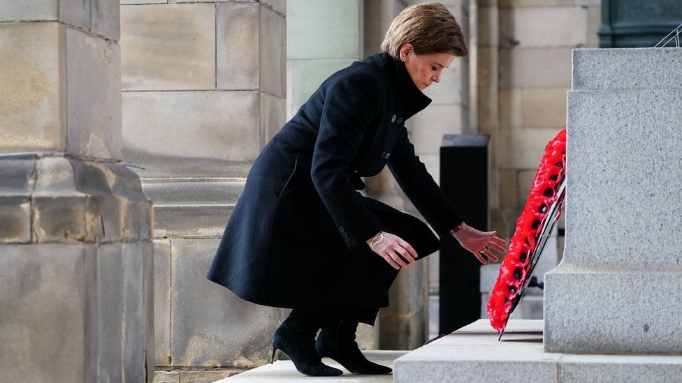 First Minister Nicola Sturgeon lays a wreath outside Edinburgh City Chambers