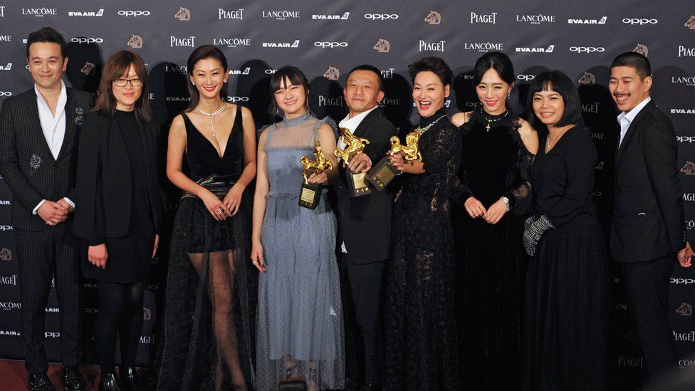 The cast of The Bold, The Corrupt and The Beautiful pose with their awards at the Golden Horse Film Awards