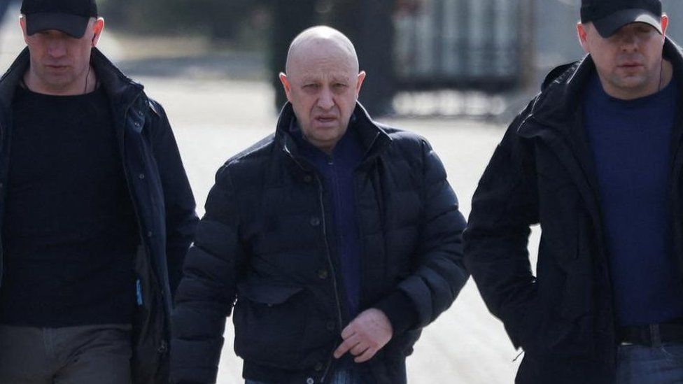  Founder of Wagner private mercenary group Yevgeny Prigozhin walking along with two protection officers