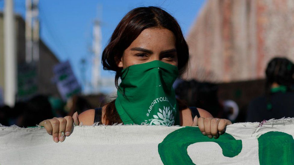 A protester wearing a green handkerchief participates in a demonstration in favor of the decriminalization of abortion on 28 September