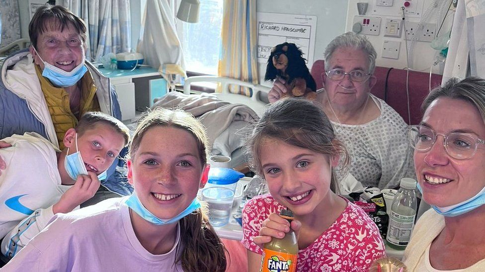 Richard in hospital surrounded by family
