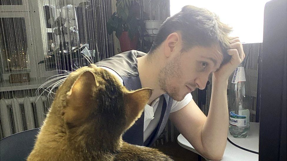 Arseniy Kisliak and his orange cat Tishka