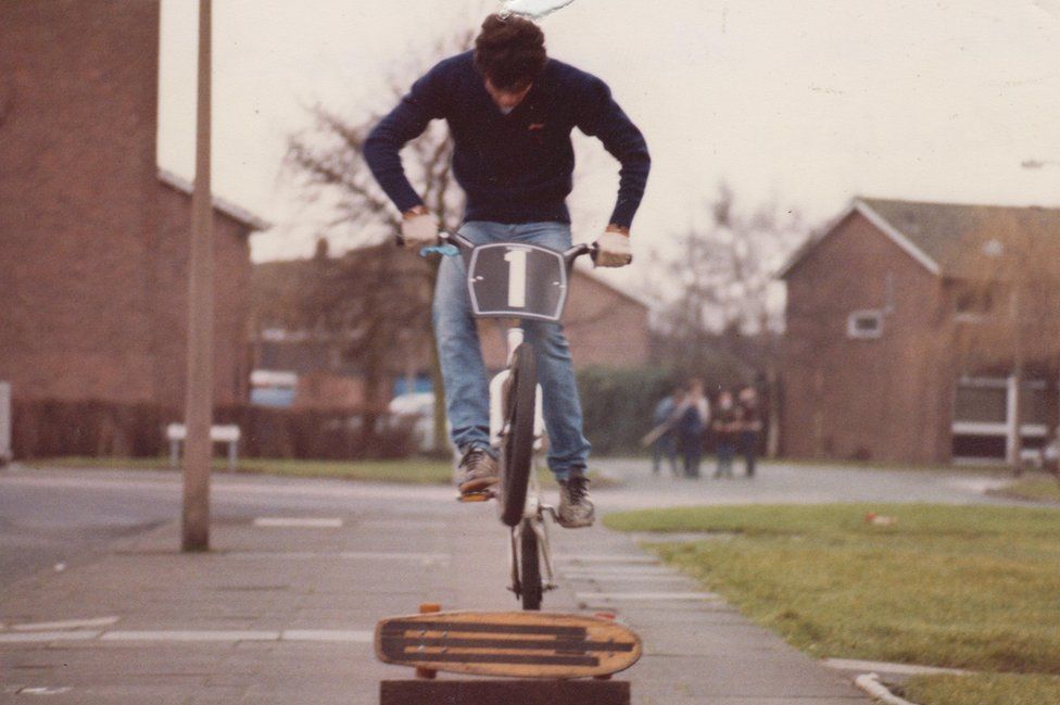 BOy rides over skateboard in an estate