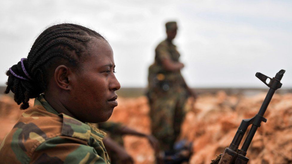 Ethiopian solider holds a gun in Somalia