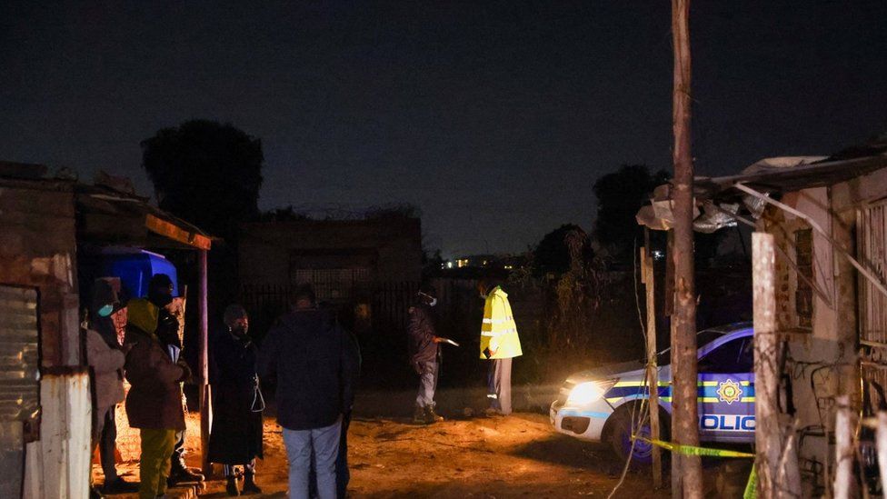 Police inspect the scene of a suspected gas leak in Boksburg's Angelo shanty town. Photo: 6 July 2023