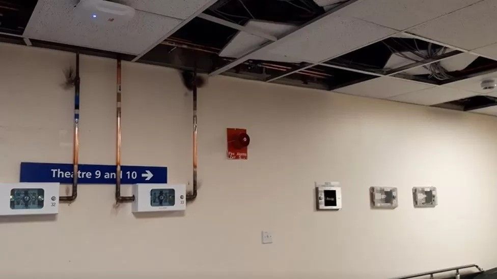 Ceiling tiles missing and pipes on display