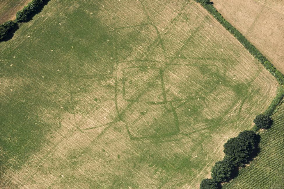 Parch marks of a Roman farm in a field of grass at Bicton, Devon