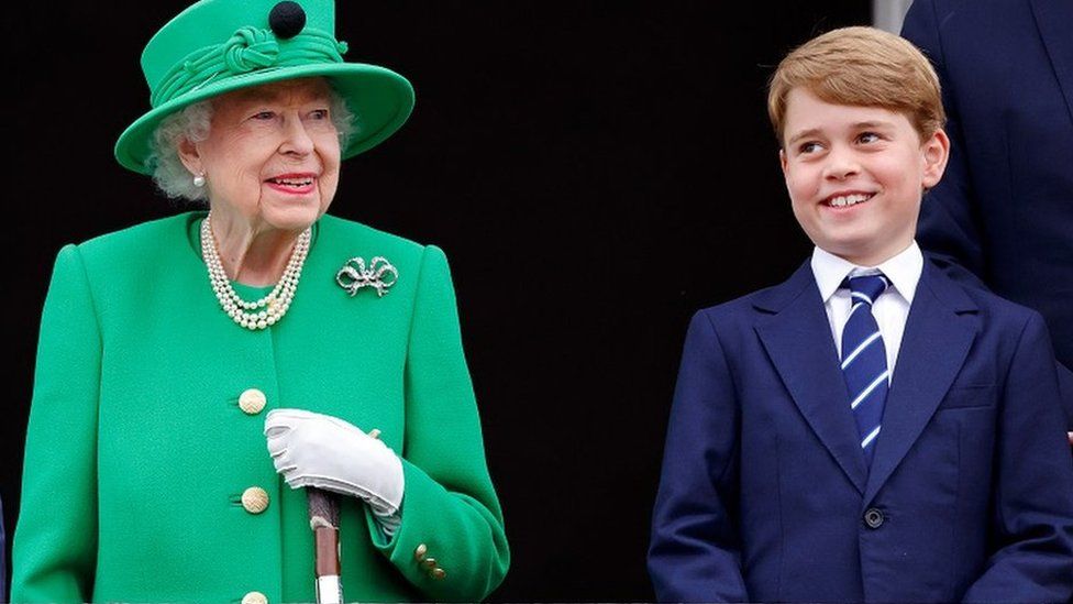 Queen Elizabeth II in green with her antler walking stick