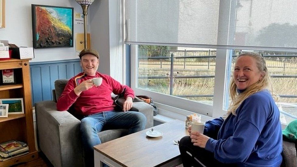 Photo of customers enjoying a coffee