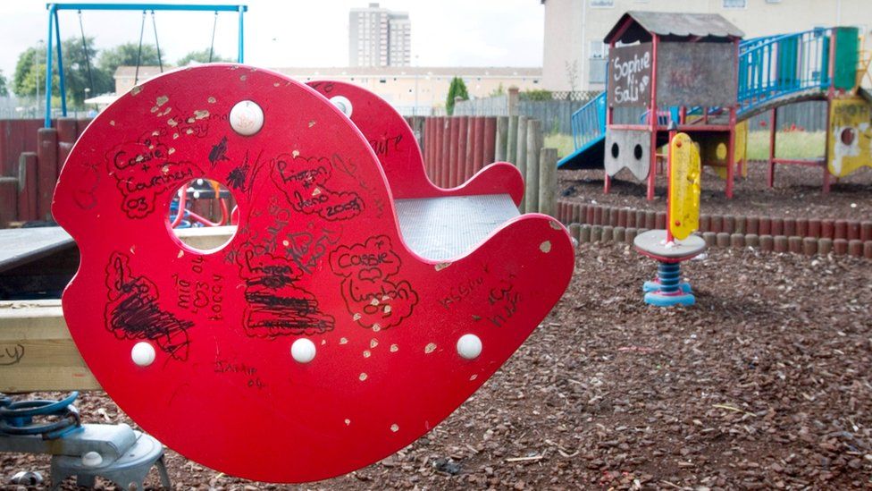 Children's play area covered in graffiti