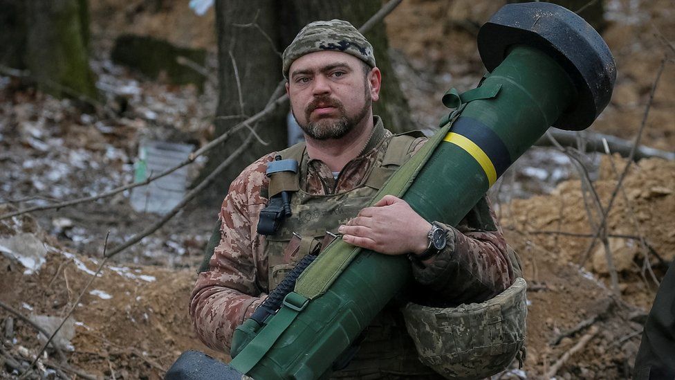 A Ukrainian service member holds a Javelin missile system at a position on the front line in the north Kyiv region