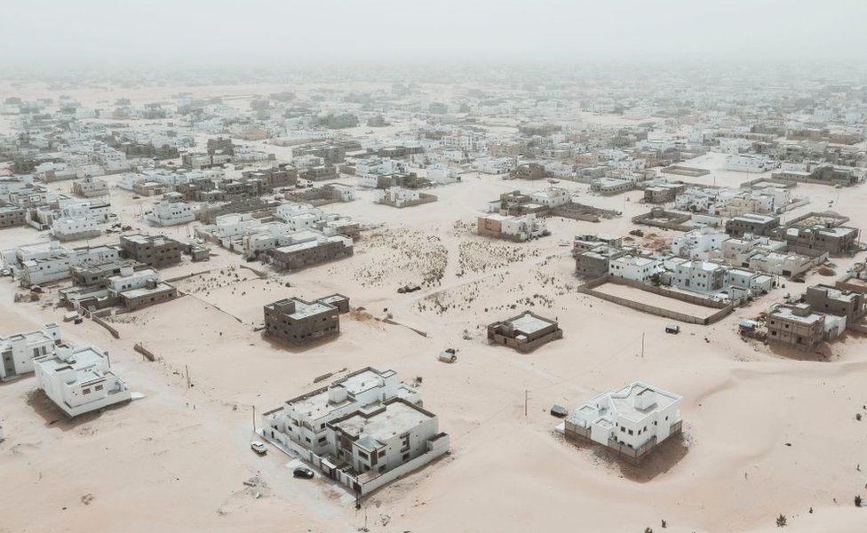 This aerial view shows newly built houses and construction sites in the Saharawi area on the outskirts of Nouakchott, on March 14, 2023