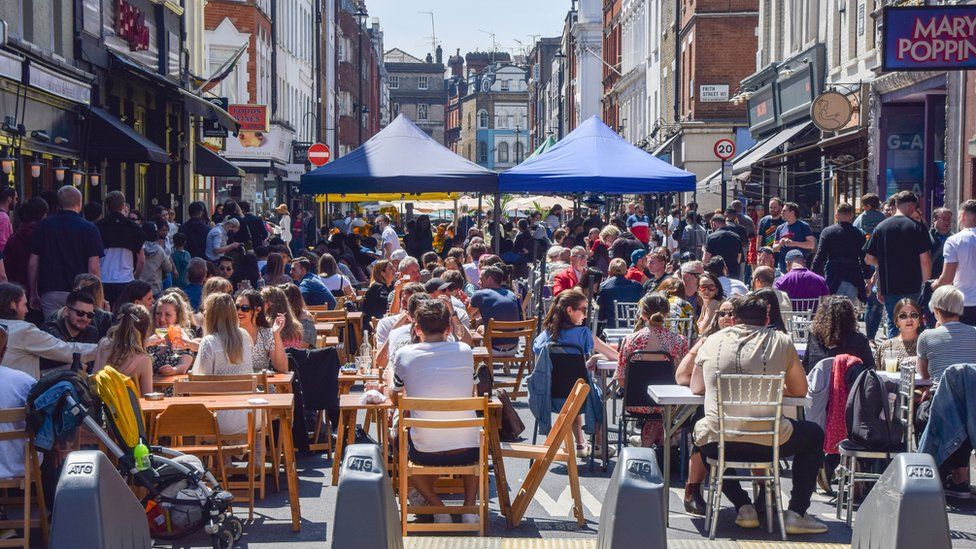 Busy restaurants in Soho in central London on Sunday
