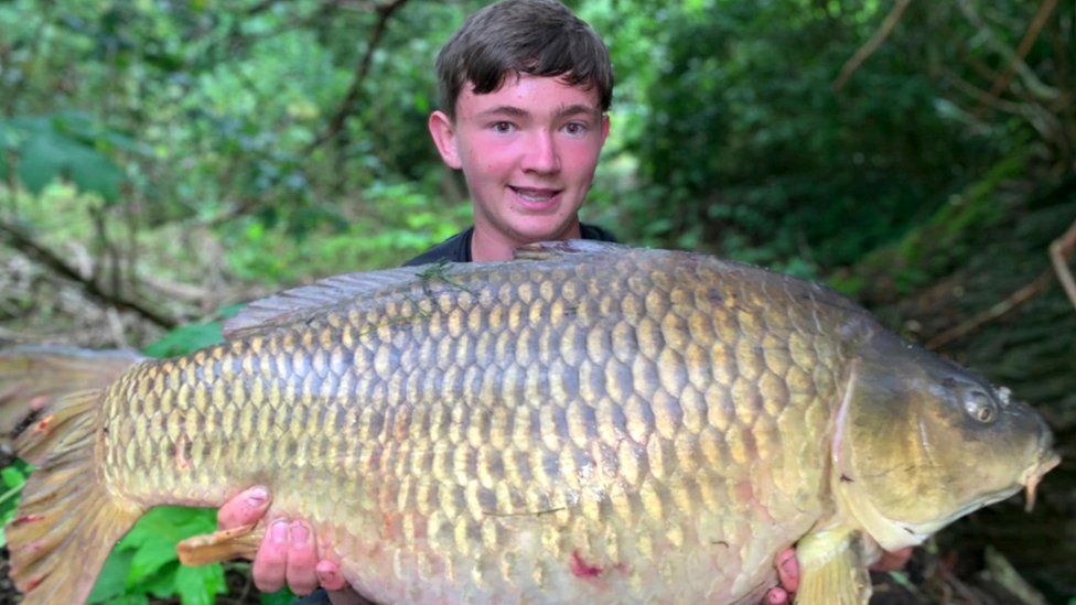 Teenage angler reels in record catch from Salford river - BBC News