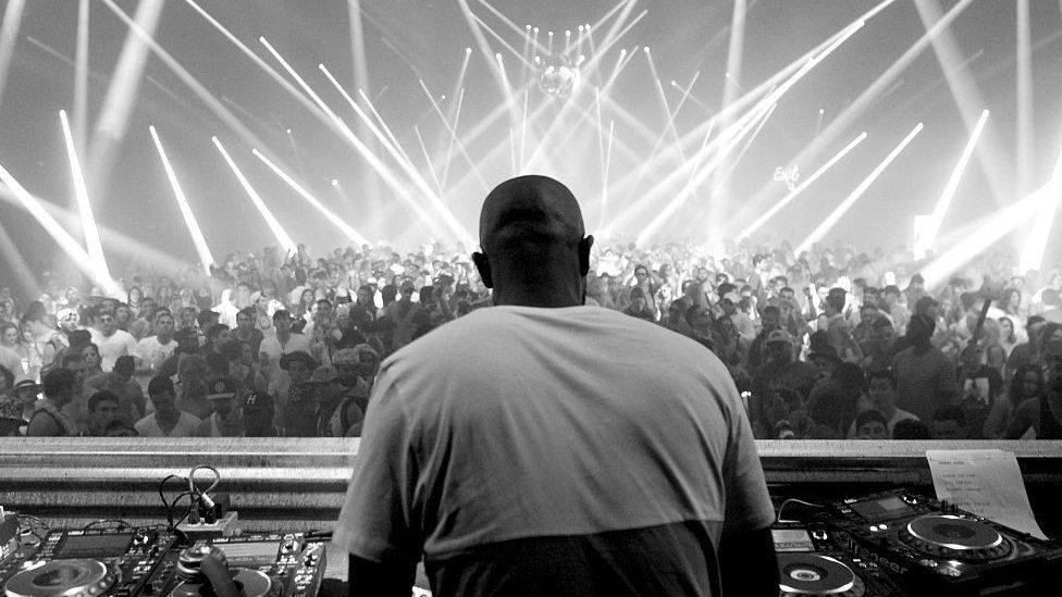 Black and white photo of Black Coffee performing at Coachella