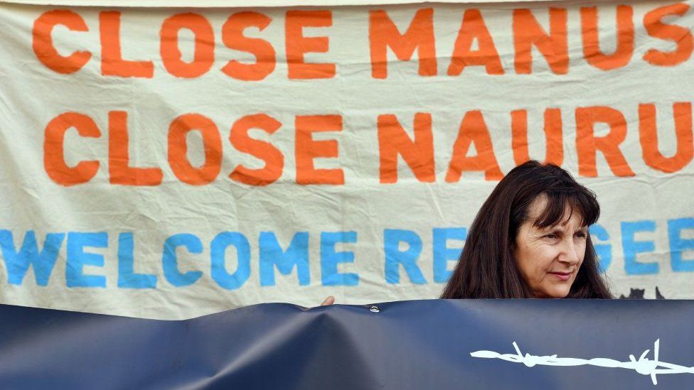 A woman protests against Australia's offshore detention centres for asylum seekers