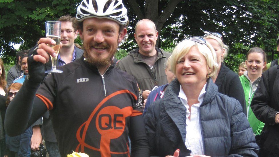 Mike Hall with his mother Pat in London after he won a round-the-world bike race in 2012