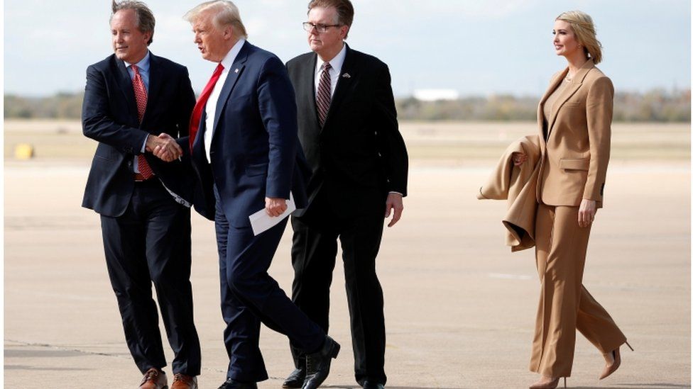President Donald Trump and Ivanka Trump are greeted by Texas Lt. Governor Dan Patrick and Attorney General Ken Paxton