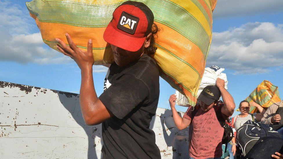 Venezuelan citizens cross from their country to Colombia, through the Simon Bolivar International Bridge, in Cucuta, Colombia