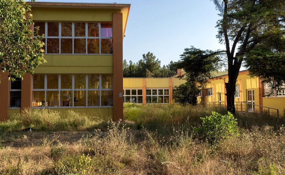 One of the two schools shut down due to the high level of pollutants on the “ecological hills” that were built between the schools and the plant