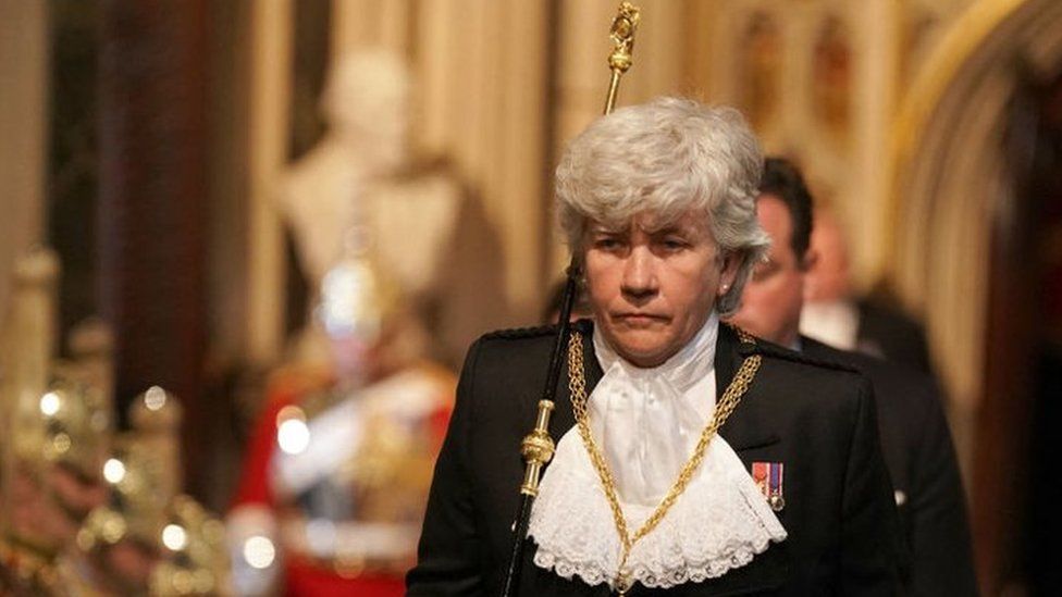 Lady usher of the Black Rod, Sarah Clarke walks through the Norman Porch for the State Opening of Parliament at the Houses of Parliament, on 10 May, 2022.