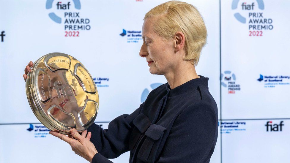 Tilda Swinton with the award