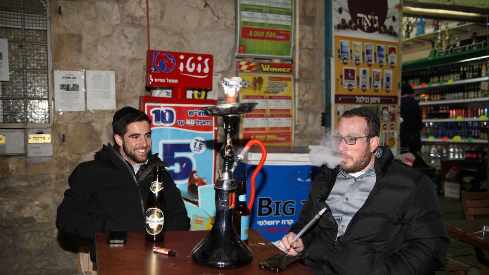 Men smoking in Jerusalem pub