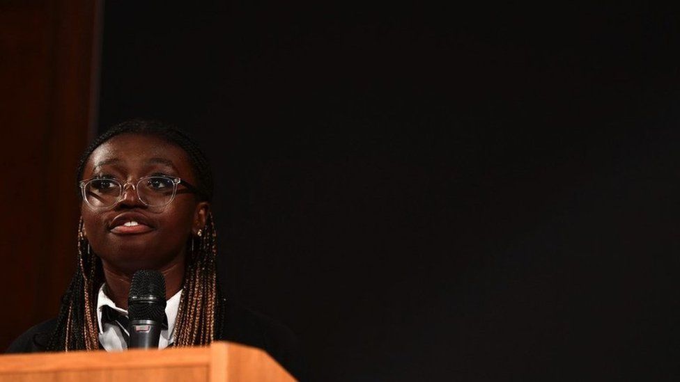 Richael Forson reading her essay at the Royal Institution in London