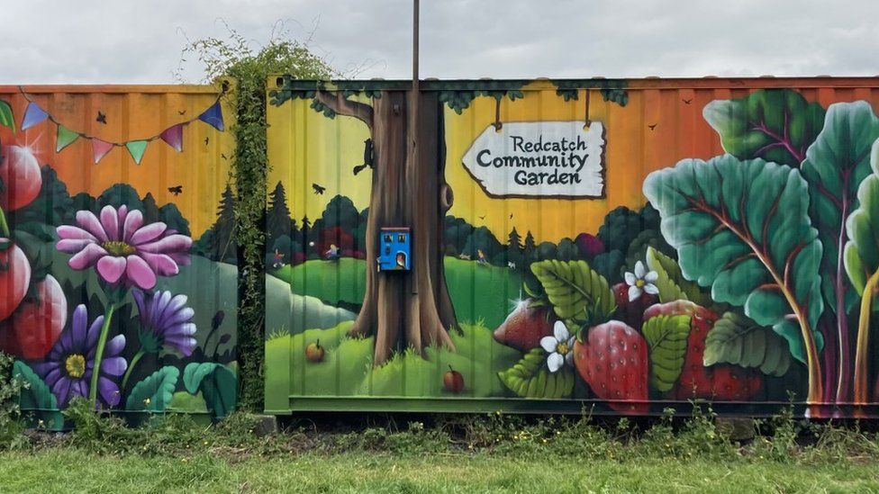 A vibrant mural on Redcatch Community Garden's fence