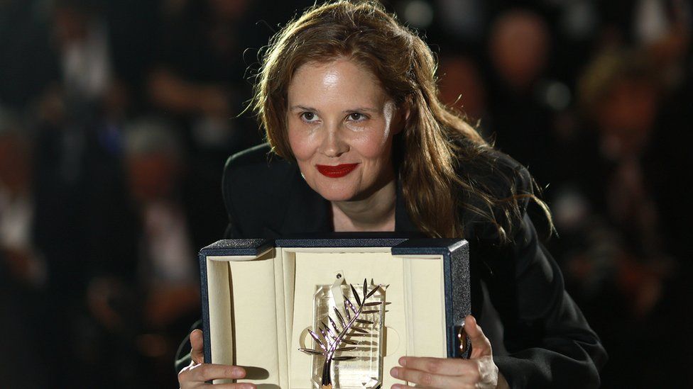 Justine Triet victor  of the Palme d'Or for the movie  'Anatomie d'une Chute' (Anatomy of a Fall), poses during the Award Winners' photocall astatine  the Closing Ceremony of the 76th yearly  Cannes Film Festival, successful  Cannes, France, 27 May 2023.