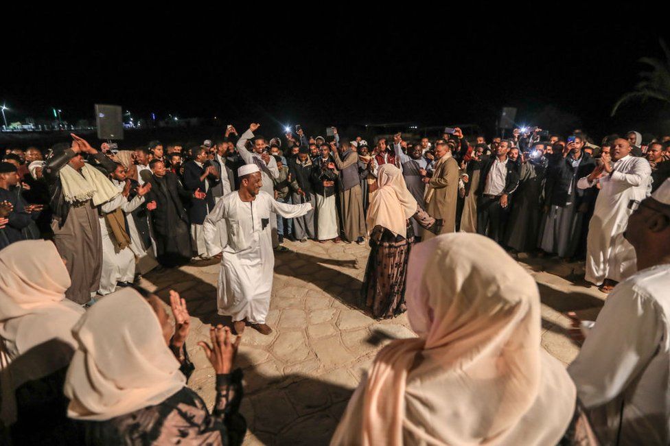 People celebrate with Nubian folk dance during a gathering near the Abu Simbel temple.