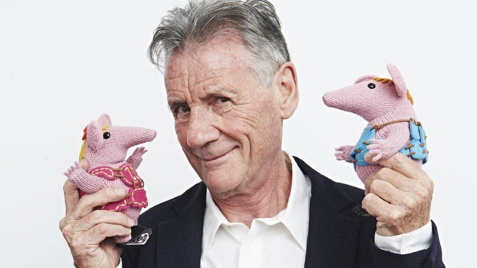 Michael Palin with two of the puppets from The Clangers