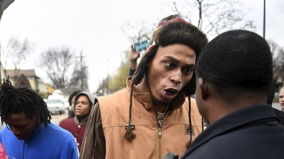A protester yelling at police