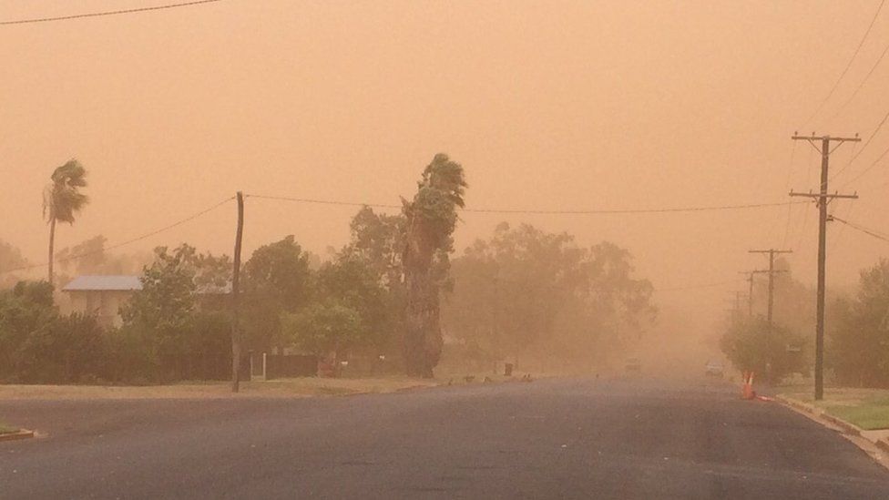 A dust storm covers a street in Charleville