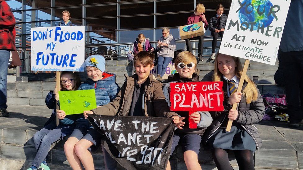 Primary school children with placards